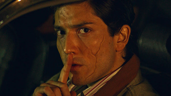Raul (Néstor Cantillana) signals for silence in A Yard of Jackals.