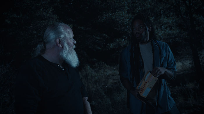 Porter and Garrett, the two hired guns, face off in the dark woods in Dark Side of Night. 