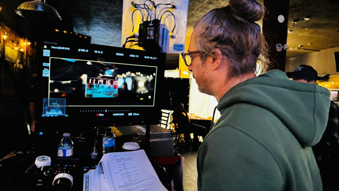 Director Boris Mojsovski reviews edits on a monitor during Foreign Tongue post-production.
