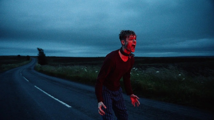 Tommy (Anson Boon) screaming on a dark roadside in Heel.