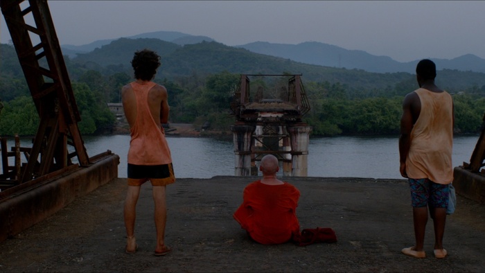 Lee, Sol, and Mike stand on a broken bridge in Jet Trash.