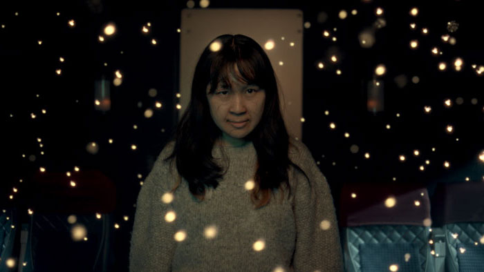 A possessed passenger surrounded by glowing lights in Speed Demon.
