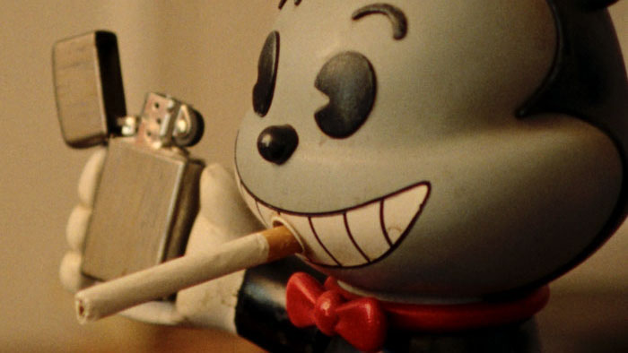 Biffo cartoon figure holding a lighter in Treasure of the Lost Reel.