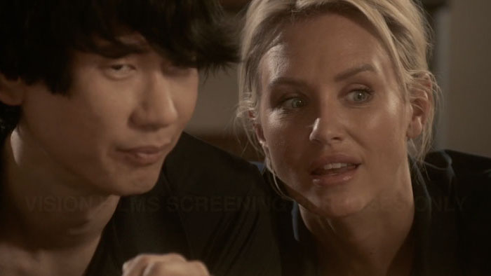 Ahn (Brian A. Metcalf) and Crystal (Nicky Whelan) share a worried moment in A Crime Story.