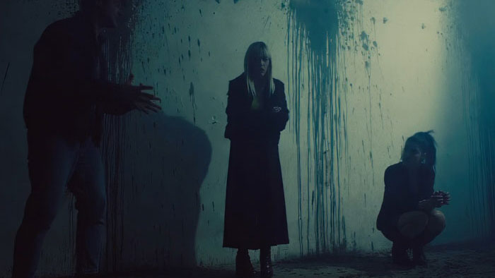 Two women trapped in a blood-splattered bunker room in Blades in the Darkness.