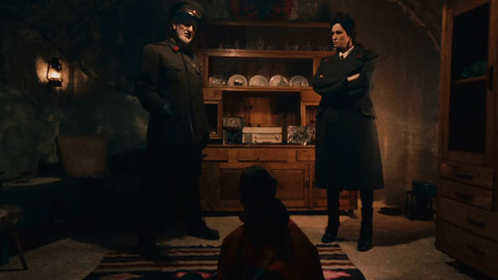 The Commander (Francesco Rossini) looms over young Matia (Matia Cobanaj) in Blades in the Darkness.