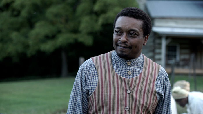 Washington Barker (Bryant Bentley) stands outside in Escape 28.