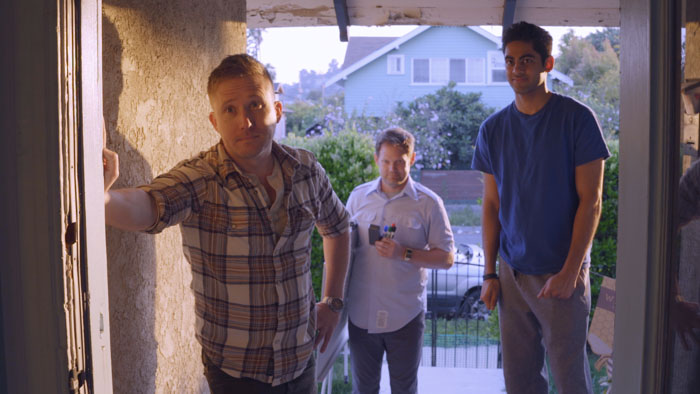 Nick, Lucas, and Ravi stand in a doorway together in Tales from the Crypto.