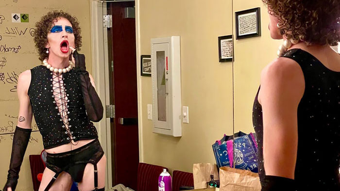 Kenny Starling preparing backstage for a Rocky Horror-inspired performance in Time Warp.