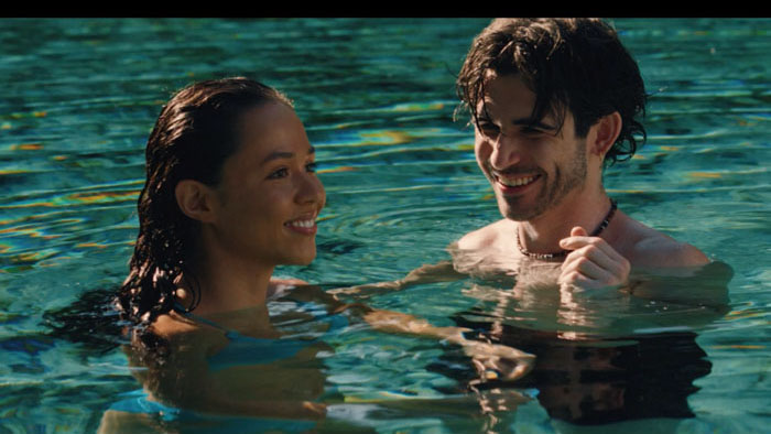 Ari (Breanna Yde) smiles with a friend in the water in Urchins.