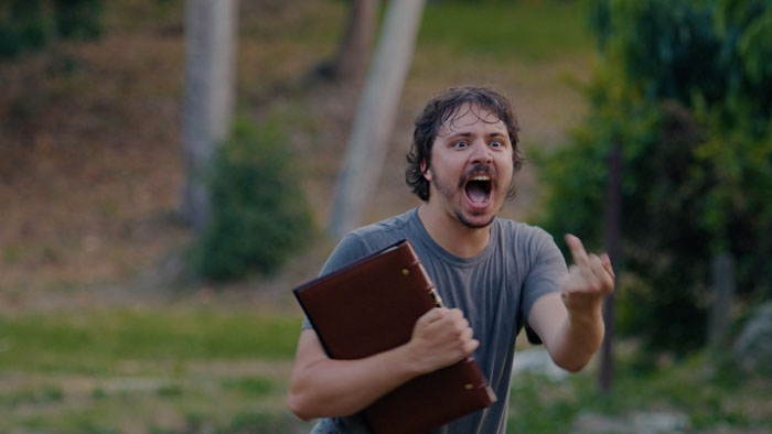 Raymond (Sean Rey) clutches his father’s documents during an emotional moment in Coconut Valley.