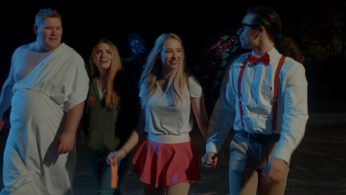 Hadley (Emma Reinagel) and friends walk in Halloween costumes at night in Happy Halloween.