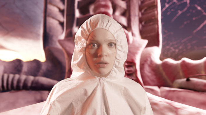 Orchis (Clara McGough) stares wide-eyed inside the fleshy Phallus Palace in The Odyssemen.