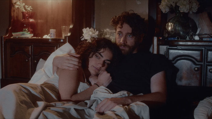 Hansel (Brian Follmer) and Deb (Kat Eaton) share a quiet moment in bed in A Perfect Copy.