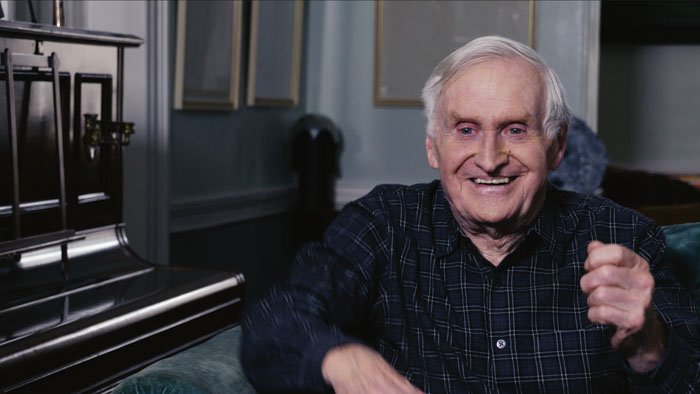 John Boorman smiles during an interview in the documentary Boorman and the Devil.