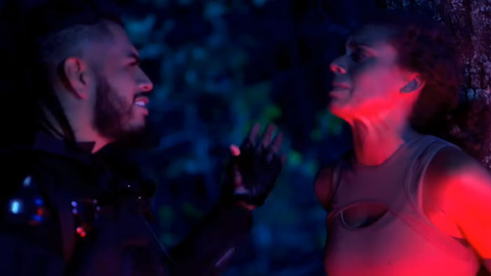 Ala'aal (Alan Silva) closes in on Chel-Soo (Chelsey Goldsmith) in a tense forest confrontation in Dark Legacy.