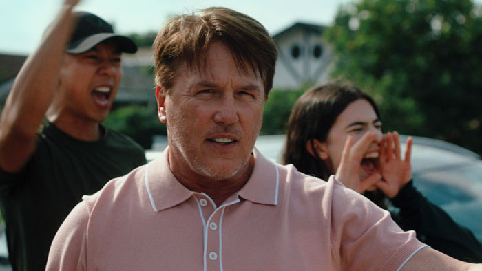 Bryan (Lochlyn Munro) shouts while rallying with ICE agents in DEI.