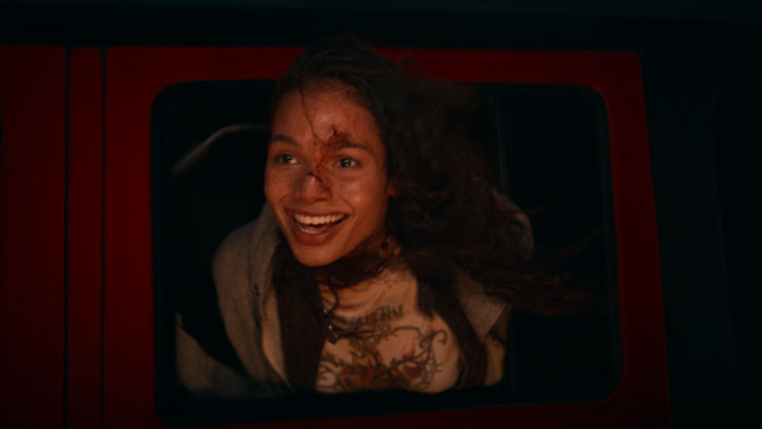 Amber (Helena Howard) leans through a vehicle window in Find Your Friends.