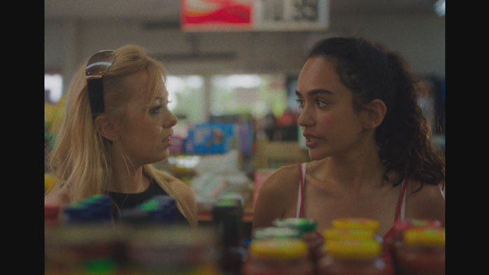 Jess (Brittany Mcvicker) and Chloe (Maya Hendricks) share a tense moment in a convenience store in Kill Trip.