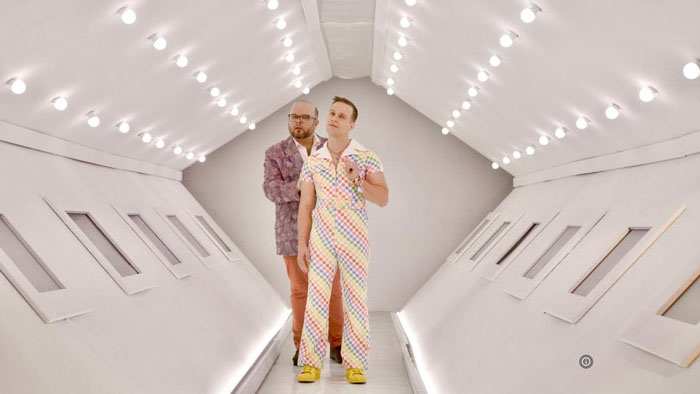 Tom Goss performs in a colorful jumpsuit during a musical dream sequence in Only Bears.