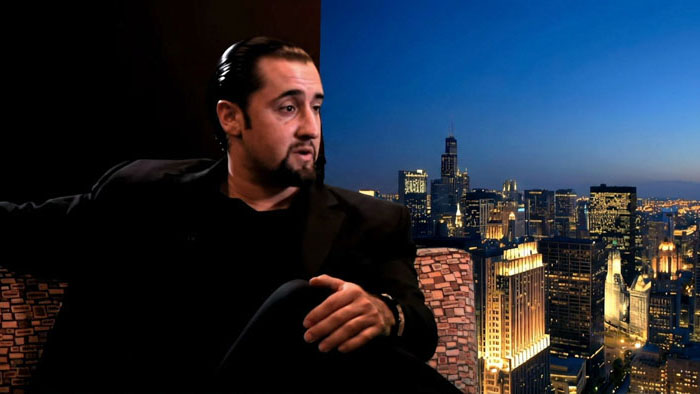 Norman Gage (Giovanni Pauletti) sits pensively before the Chicago skyline in Ride Along.