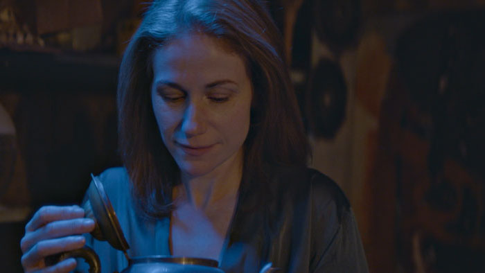 Miranda (Erica Piccininni) holds the mysterious teapot in TƎMPEST.