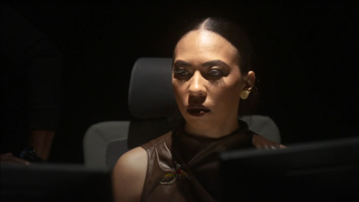 Sylvia (Miina Saray) watches computer screens closely in The Algorithm of Us.
