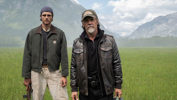 Jacob Elordi as Hig and Josh Brolin as Bangley stand together in a field in The Dog Stars.