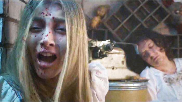 Tina (Griselda Sanchez) screams with blood on her face in a horror scene from The Dollmaker.