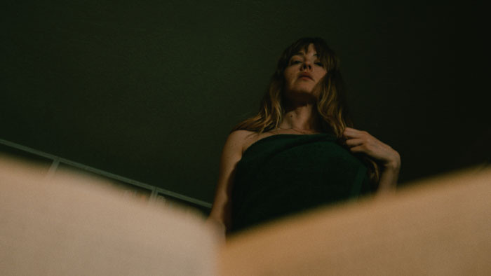 Barbara (Emma Griffin) stands over Tony in the short film The Turtle.