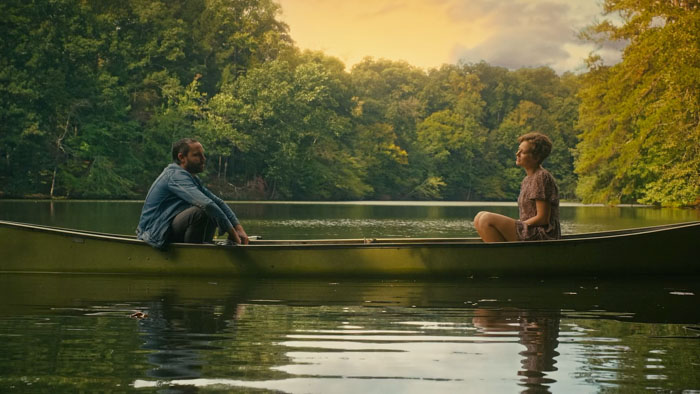 Wyatt Bailey (Michael Aaron Milligan) and Cora Roberts (Karynn Moore) canoe across a lake in Dementium.