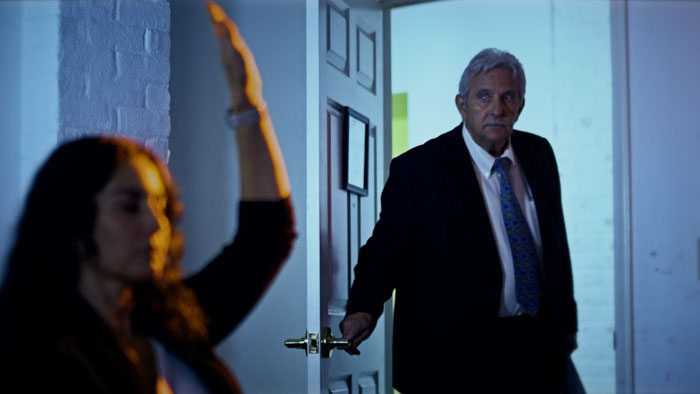 A tense doorway confrontation in a dimly lit room from Echoes from the Void.
