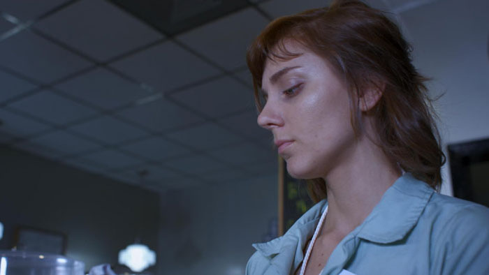 Molly (Olivia Peck) working at the diner in The All-Healing Grave.