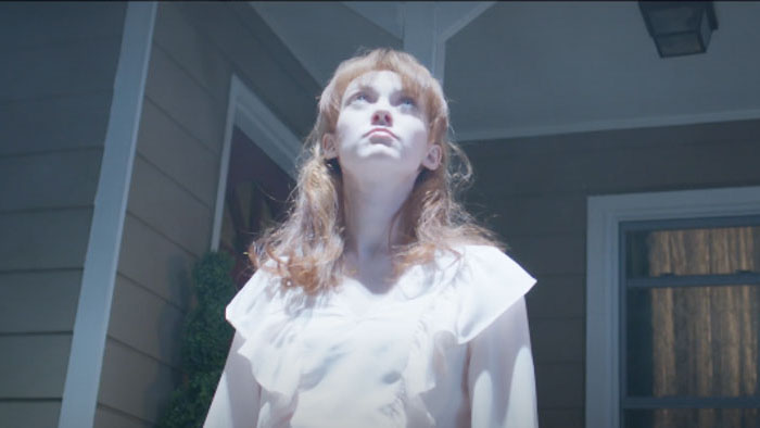 An uncredited actress portrays Amanda Llewellyn looking up at the sky in UFOs and God.